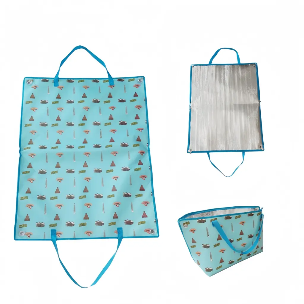 Foldable waterproof picnic bag with buckle closure and handles, shown flat, partially open, and zipped, featuring a travel-themed print—OEM/ODM customization available.